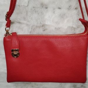 Red crossbody purse with lock and lots of room